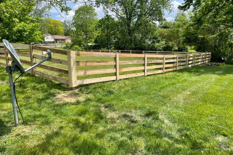 Wood rail fence with wire mesh installed in a Charleston, SC backyard by FenceCraft