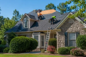 Professional roof replacement contractor installing new shingles on a home in Marietta GA
